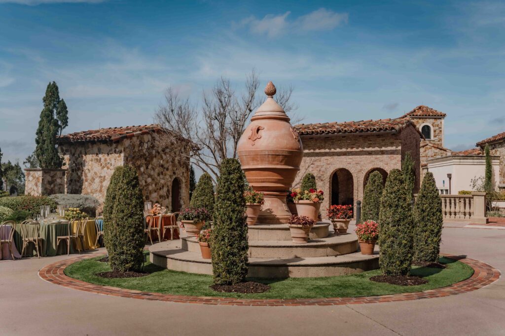 circular roundabout with fountain in the middle and shrubs surrounding the fountain
