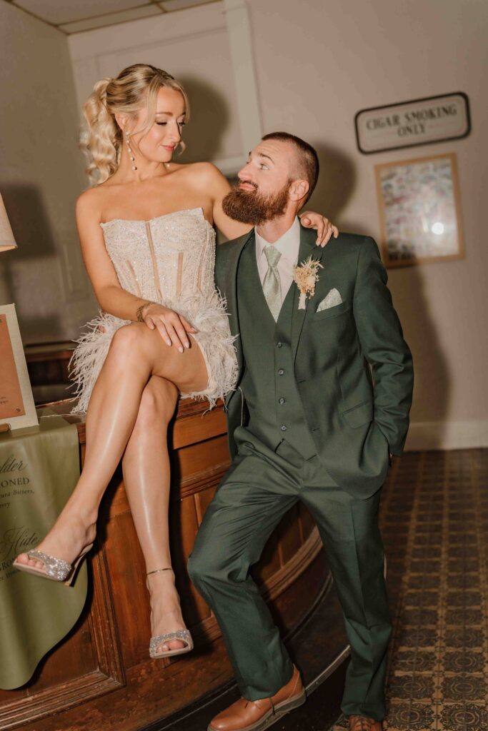 couple looking at each other at the bar in a cigar lounge