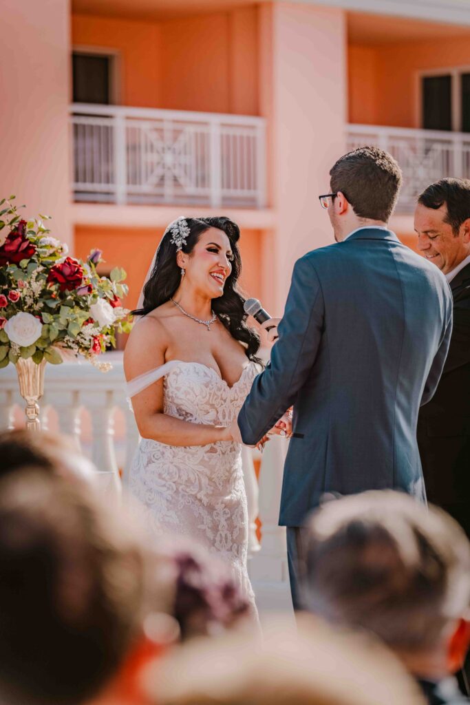 bride and groom holding hands at rooftop wedding ceremony in clearwater florida