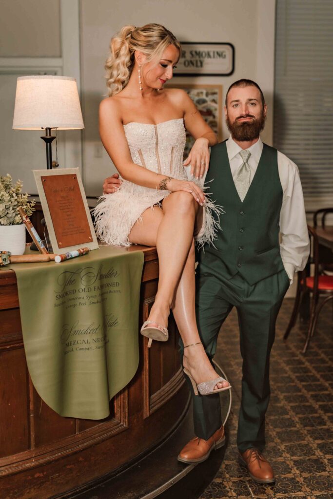 couple in a cigar lounge looking at the camera
