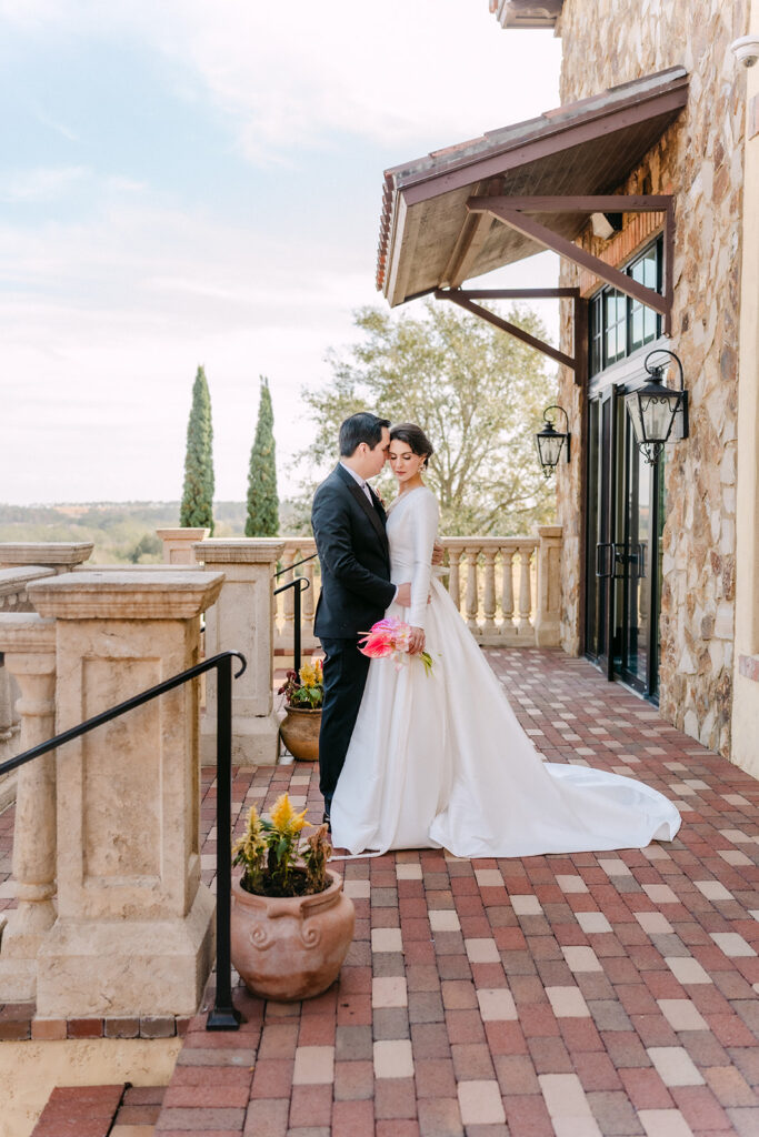 bride and group looking at each other on a terrace