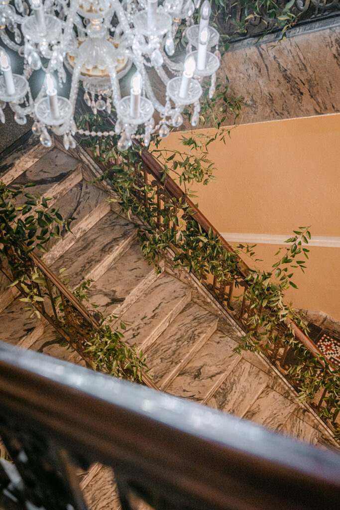 greenery around staircase leading to the main hall