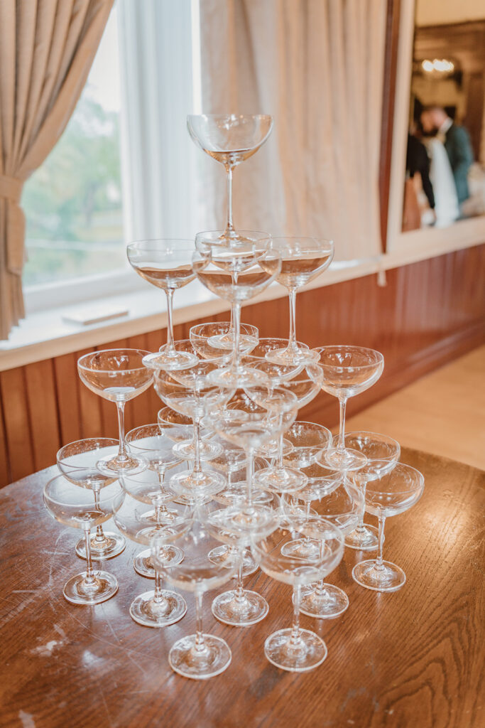 champagne glasses stacked on top of the tower