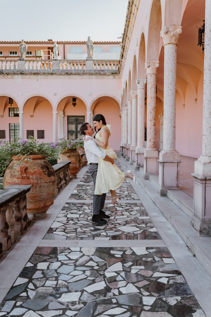 man lifting woman in air at the ringling