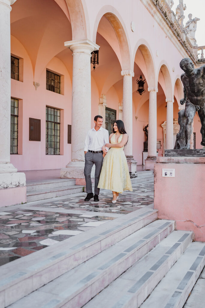 man and woman walking towards the camera and looking at each other